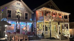 A building with a sign reading "CHEESEHOUSE BREW CO." and another sign "LYMAN."