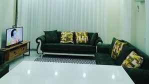 Family Apartment, 2 Bedrooms, Sea View | Living area | TV