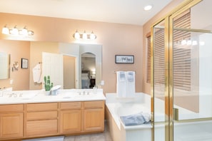 Combined shower/tub, hair dryer, towels, soap