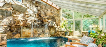 Riverside opulence with game room, private heated pool, hot tub & firepit