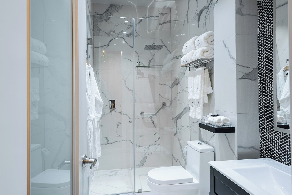 Bathroom | Shower, rainfall showerhead, hair dryer, bathrobes