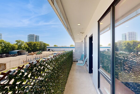 Enjoy expansive city views from the comfort of our hotel's contemporary corridor.