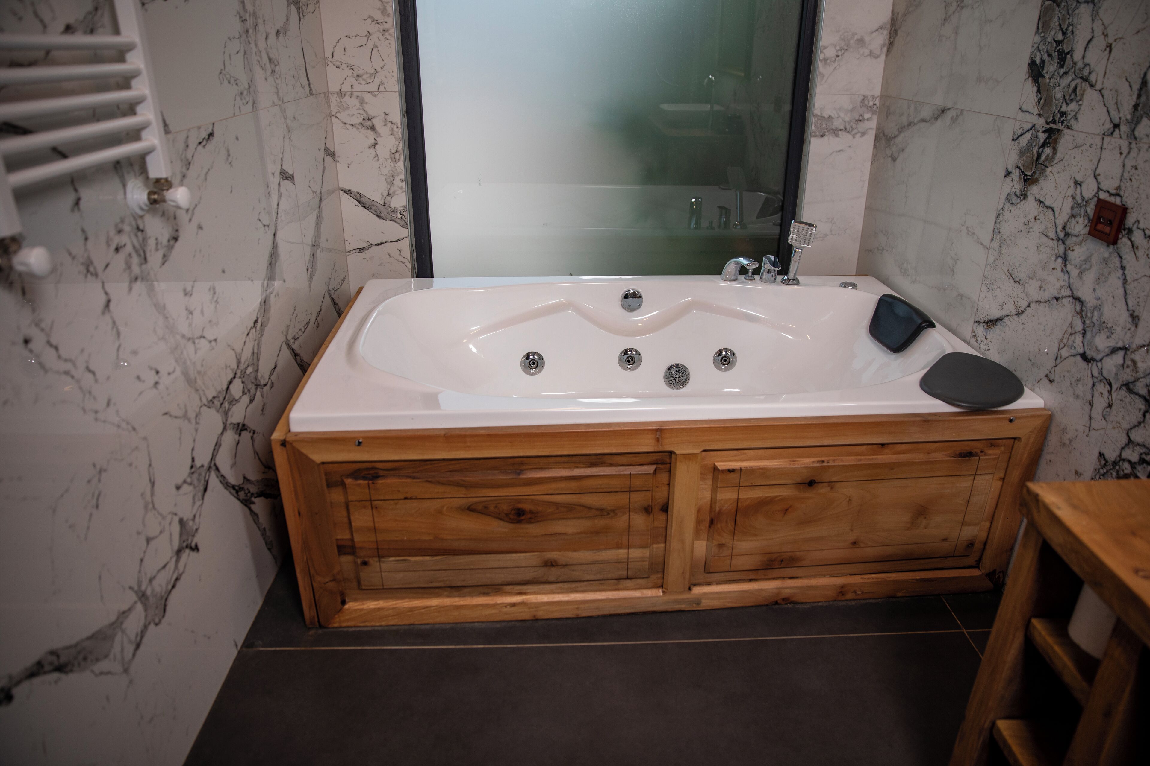 presidential studio suite | bathroom | rainfall showerhead, free toiletries, hair dryer, bathrobes