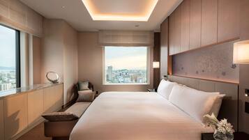 Deluxe Suite, 1 King Bed | In-room safe, desk, laptop workspace, blackout drapes