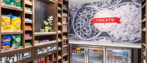 A snack and sundries section with shelves stocked with chips, snacks, and beverages.