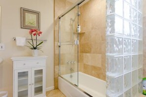 Combined shower/tub, hair dryer, towels, soap