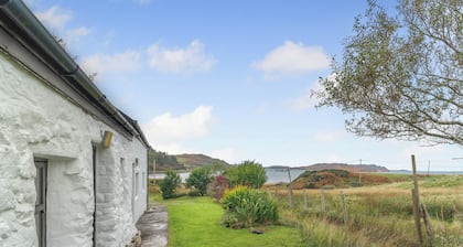 A tiny, traditional cottage tucked away on the Ross of Mull, close to the sea.
