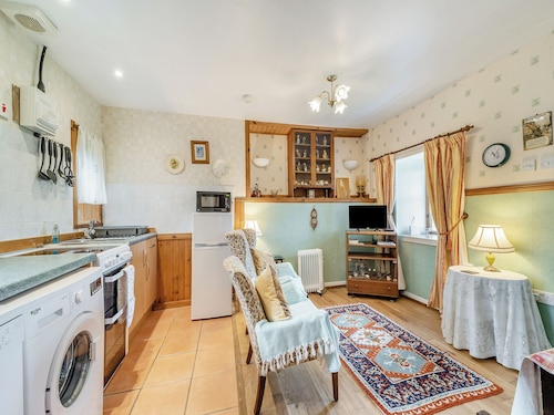 A tiny, traditional cottage tucked away on the Ross of Mull, close to the sea.