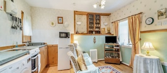 A tiny, traditional cottage tucked away on the Ross of Mull, close to the sea.