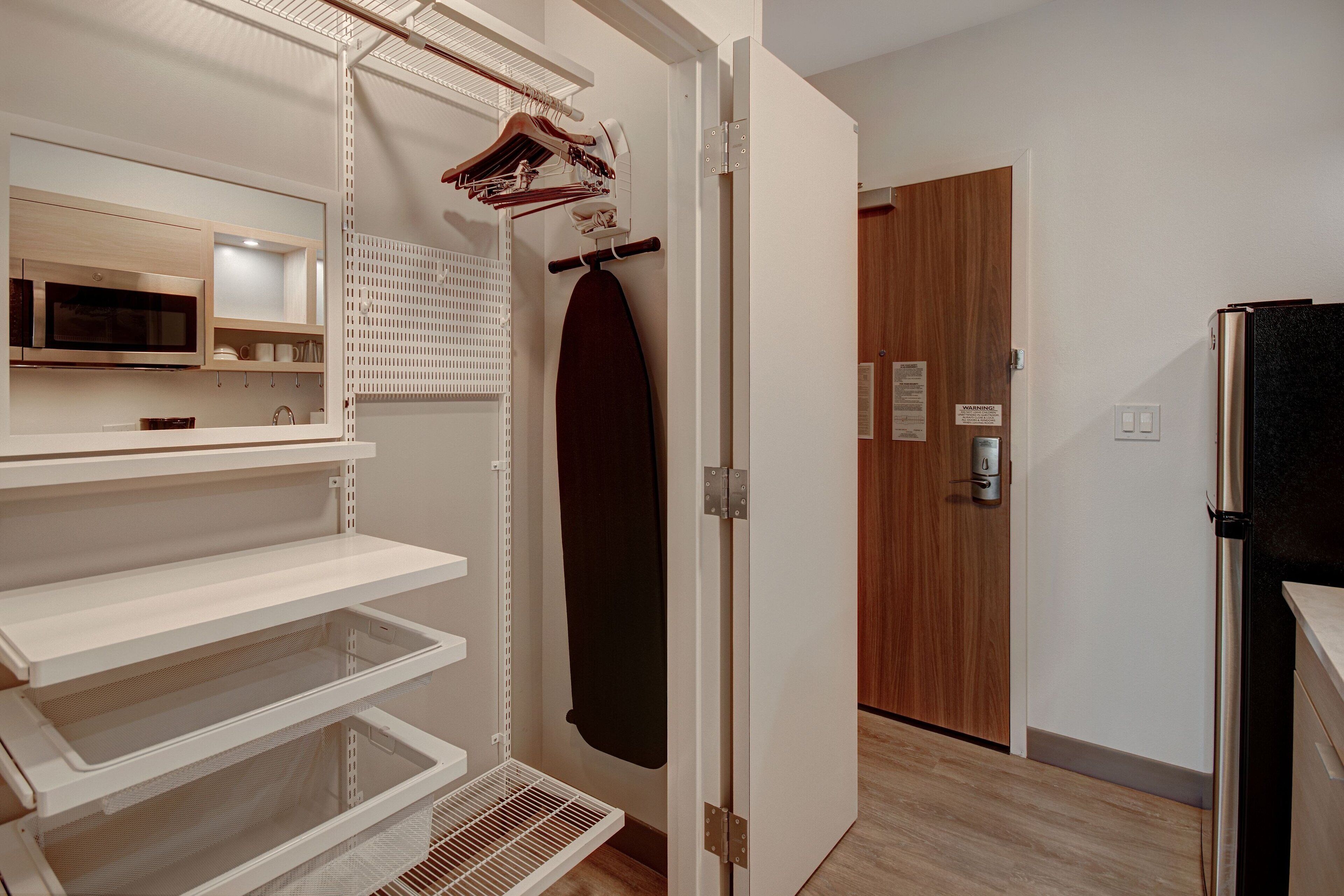 desk, laptop workspace, blackout curtains, iron/ironing board