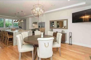Enjoy meals in this stylish dining area with a round table and six comfortable chairs.