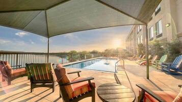 Outdoor pool, open 7:00 AM to 11:00 PM, pool umbrellas, sun loungers