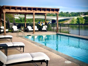 Outdoor pool, open 7:00 AM to 11:00 PM, pool umbrellas, sun loungers