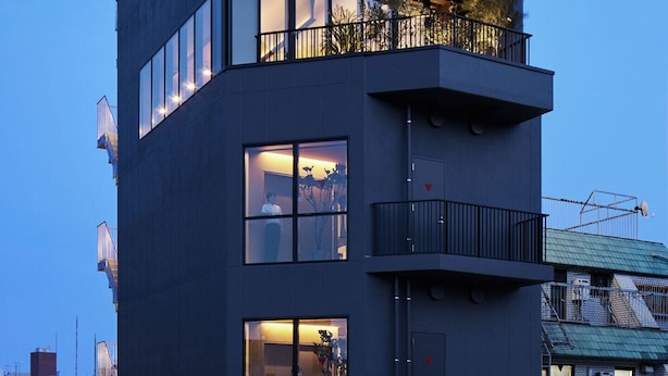 A modern multi-story building with balconies and large windows. - 9h nine hours woman Shinjuku (Tokyo)