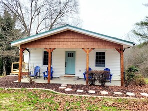 A single-story house with a porch, a front door, and two windows. - CHARMING COTTAGE LESS THAN 5 MILES TO DOWNTOWN BLUE RIDGE (Blue Ridge)