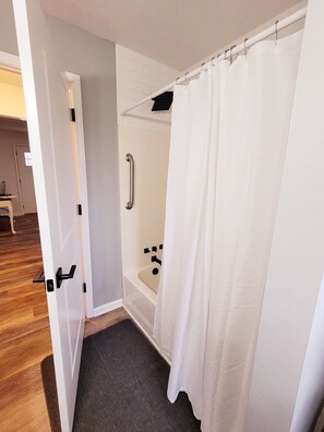 Combined shower/tub, hair dryer, towels, soap