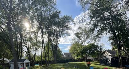 Contemporary home in quiet neighborhood with pool & great back yard close to all