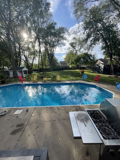 Contemporary home in quiet neighborhood with pool & great back yard close to all