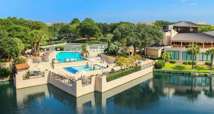 Fun island retreat with pool, hot tub, beach access & balcony
