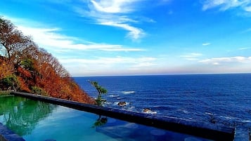 Outdoor pool, open 8:00 AM to 7:00 PM, pool umbrellas, sun loungers