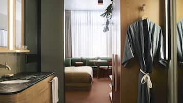 Designer toiletries, hair dryer, bathrobes, towels