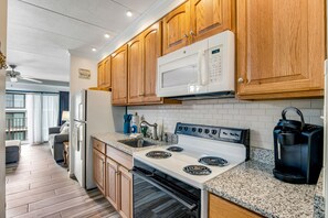 Fridge, microwave, oven, stovetop - Third-Floor Condo with High-Speed WiFi, & Balcony – Steps From the Beach (Ocean City)