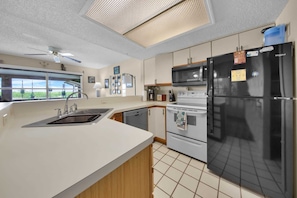 Fridge, microwave, coffee/tea maker, dining tables
