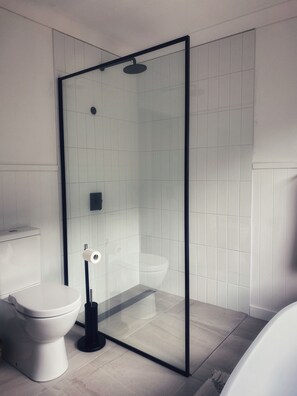 Bathtub, hair dryer, towels, soap