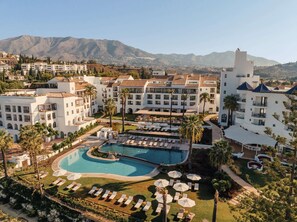 A resort with a large pool, multiple buildings, and a mountainous backdrop. - La Zambra Resort Mijas - Marbella The Unbound Collection By Hyatt (Mijas)