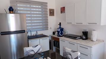 Fridge, microwave, stovetop, coffee/tea maker