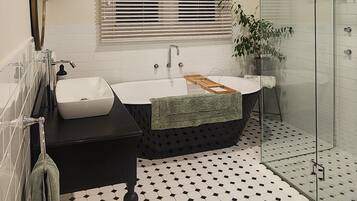 Bathtub, hair dryer, towels, soap