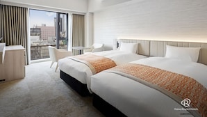 A hotel room with two beds, a desk, and a chair. - Daiwa Roynet Hotel Sendai-nishiguchi PREMIER (Sendai)