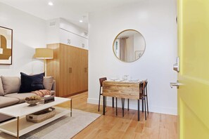 Smart TV, offices - 1-Bedroom Suite: Stylish Living with Parking and Pet Perks (Charleston)