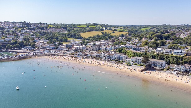 An aerial view of a coastal town with a beach, houses, and boats. - Plas Gwyn - Walk to Beach Parking Enclosed Garden (Saundersfoot)