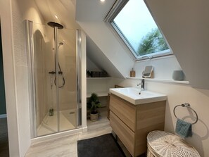 Shower, hair dryer, towels, soap