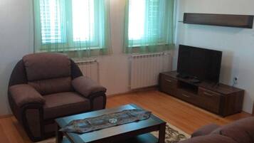 House | Living room | 30-inch TV with digital channels