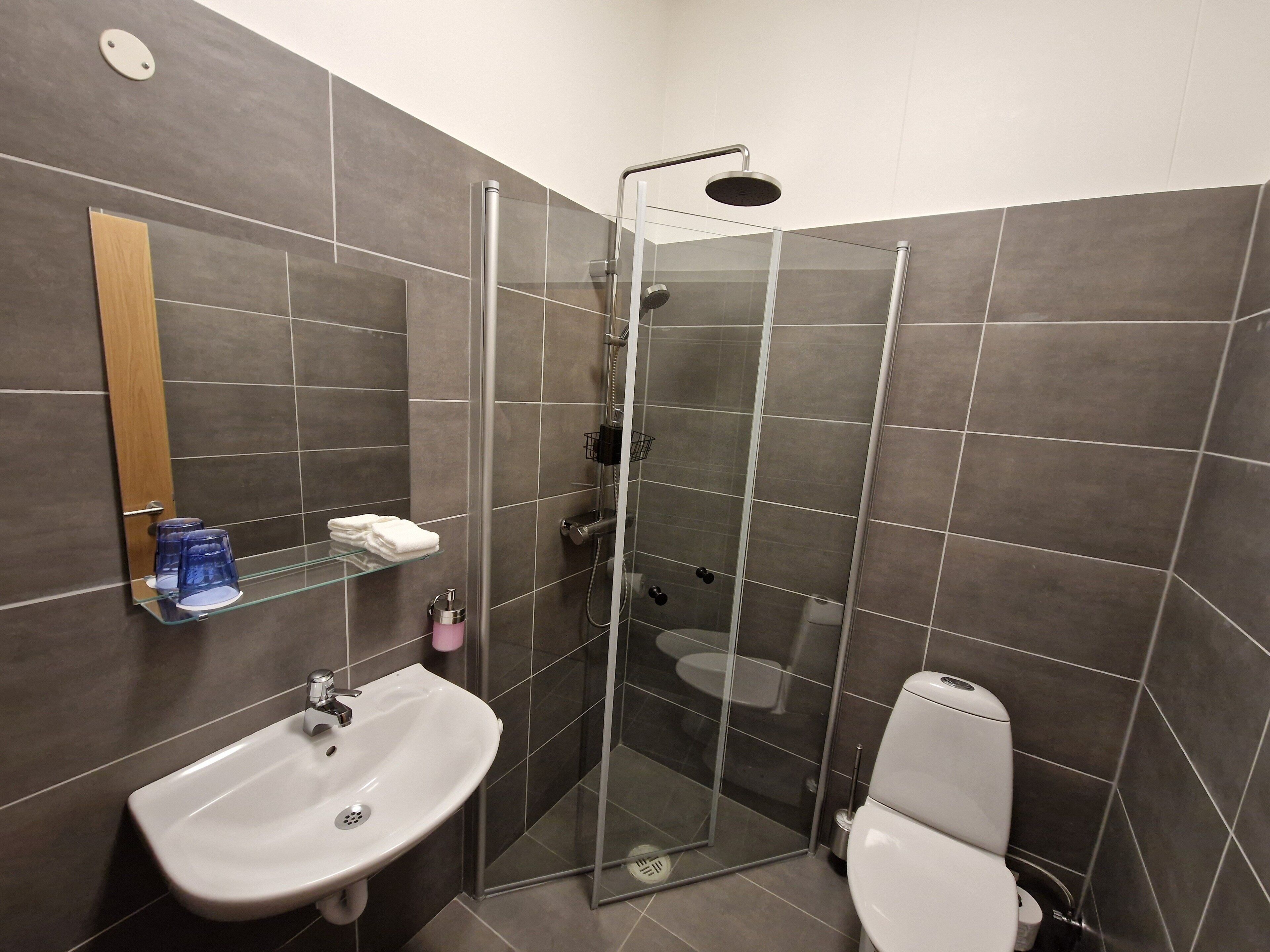 shower, rainfall showerhead, hair dryer, towels