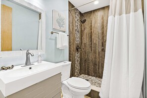 Shower, hair dryer, towels, shampoo