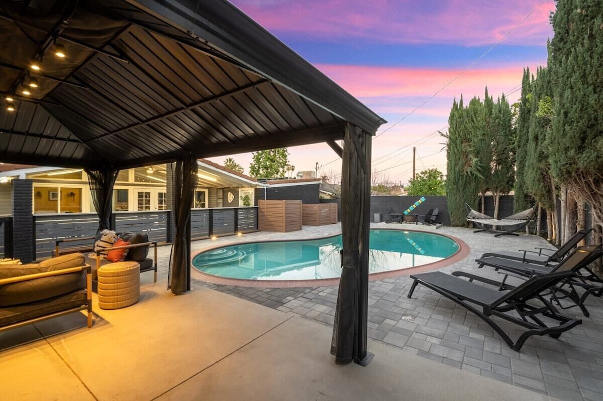 **INDOOR/OUTDOOR LIVING!** CABANA, BBQ, HTD POOL