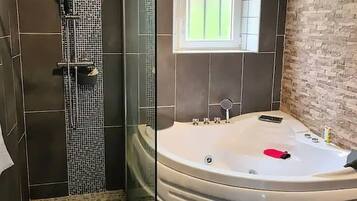 Shower, jetted tub, hair dryer, soap
