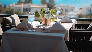 A table set for dining with a view of the sea and mountains. - Roas Hotel (Bodrum)