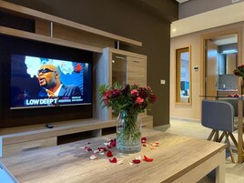 Deluxe Suite, 2 Queen Beds | Living area | 48-inch Smart TV with satellite channels, Netflix, streaming services