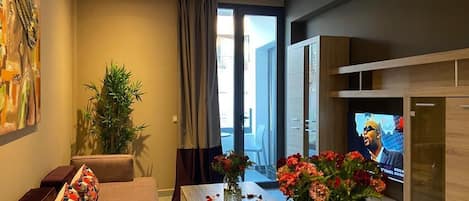 Deluxe Suite, 2 Queen Beds | Living area | 48-inch Smart TV with satellite channels, Netflix, streaming services