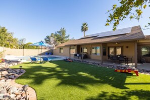 A heated pool, sun loungers