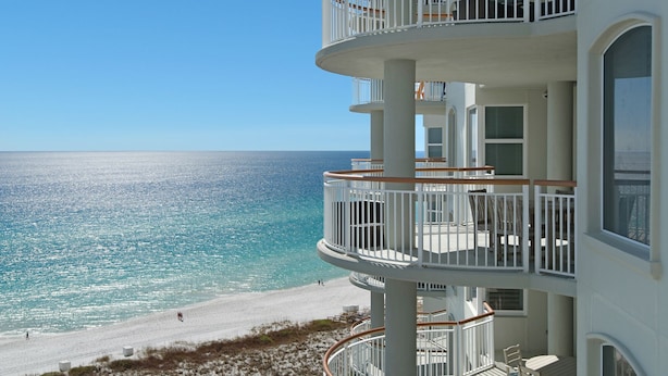 A multi-story building with balconies overlooking a beach and the ocean. - Beach Colony West 12A Gulf-Front 3 BD/3BA w/Beach Service & Onsite Management (Navarre Beach)