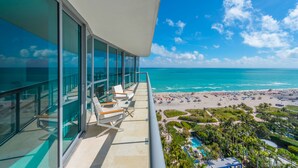 A balcony with a view of the beach and ocean. - Oceanfront Private Condo at The Setai -2208 (Miami Beach)