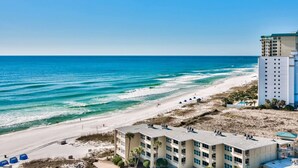 A beachfront hotel with multiple floors, a sandy beach, and ocean views. - Spectacular views of the Gulf and Emerald coast - 16th floor. (Destin)