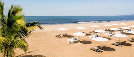 On the beach, sun-loungers, beach towels