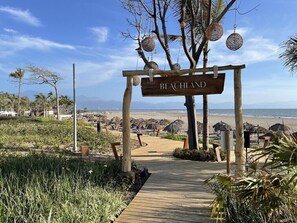 On the beach, sun loungers, beach towels