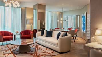 Suite, 1 King Bed, Non Smoking, Pool View (Astor) | Living area | 65-inch LED TV with satellite channels, TV